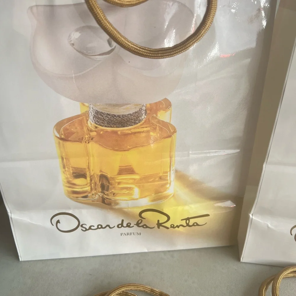 Oscar de la Renta gift bags with gold tone handles. New never used. Total 10.